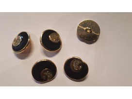 Goudkleurige metalen damesknoop. Zwart met goud.  Doorsnee 18 mm.