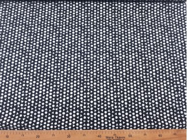 Een zwarte poplin katoen met witte mini driehoekjes en cirkels 100% katoen 1,40 mtr. breed