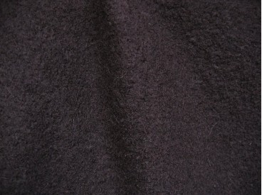 Mooie zware kwaliteit voorgekookte diep donkerbruine boucle wolvilt.  Zeer geschikt voor jasjes. Rafelt niet!  100% wol  1.45 mt