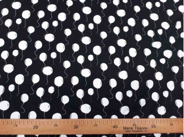 Een zwarte tricot met witte ballonnetjes.Oekotex stof 95% katoen/5% elastan 1.50 mtr.breed