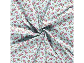 Een mintgroene poplin/katoen met roze/rode roosjes. 100% Katoen 1.45 mtr. br. 110 gram p/m2