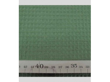 Legergroen grof wafeldoek. Het blokje is ongeveer 7 x 7 mm.  100% katoen  1.47 mtr. breed  230 gr./M2