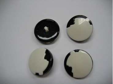 Zwart/witte kunststof knoop. 25 mm. doorsnee