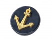Ankerknoop op steeltje van kunststof. Marineblauwe knoop met een goudkleurig anker. 18 mm doorsnee