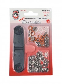 Babydrukkers. Oranje inslag drukknoop met werktuig. Een open rondje. Doorsnee 9.7 mm. 15 stuks per pakje 