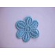 Een opnaaibare aquakleurige bloemapplicatie met een doorsnee van 50 mm  Prijs per stuk.