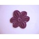 Een opnaaibare paarse bloemapplicatie met een doorsnee van 50 mm  Prijs per stuk.