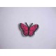 Een opstrijkbare vlinder applicatie van 3 x 2.5 cm. Pink