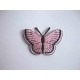 Een opstrijkbare vlinder applicatie van 5 x 3.5 cm. Roze