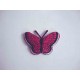 Een opstrijkbare vlinder applicatie van 5 x 3.5 cm. Donkerpink glitter