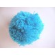 Een aqua kleurig pom pom bolletje met een doorsnee van 7 cm.  Leuk voor het garneren van mutsen capes of kleding.