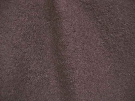 Mooie zware kwaliteit voorgekookte donkerbruine boucle wolvilt.  Zeer geschikt voor jasjes. Rafelt niet!  100% wol  1.45 mtr. br