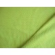 Limekleurige tricot met mini pinkkleurige stippen. Rekt zowel in de breedte als in de lengte. 95%co/5%el. 1,50 mtr. br. 200gr/m2