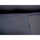 Een diep donkerblauwe jassenstof. De onderkant is glad de bovenkant iets geruwd. Winddicht, niet geheel waterdicht. Polyester  1