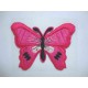 Een pink kleurige vlinder applicatie van 7 x 6 cm.  Om te plakken of te strijken, 2 in 1.