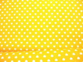 Een gele katoen met een mini wit hartje met een doorsnee van 6 mm. 100% katoen 1.45 mtr.br.