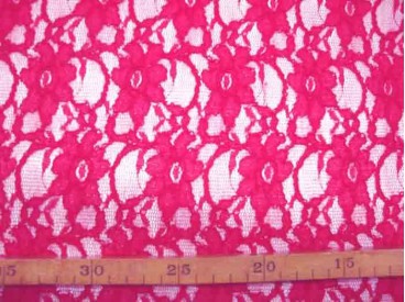 Jacquard kant stof effen donkerblauw met bloemenstiksel wat erop ligt.  Rekt in de breedte en voelt zacht aan.  140 cm breed